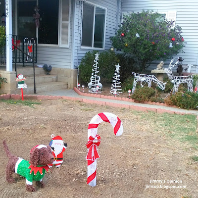 Dachshund Christmas decoration and Candy cane with reindeer an other lawn decorations in background.