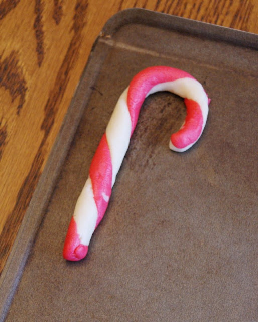 Making Candy Cane Cookies ~ two colors of almond sugar cookie dough twisted together! A fun & festive Christmas treat.  www.thekitchenismyplayground.com