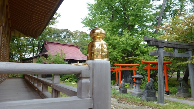 Polished brass in front of Inari shrine