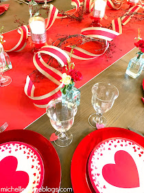 Paper runner, curled ribbon, paper plates to decorate for Valentine's Day