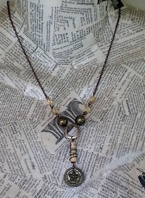 assemblage necklace with star button