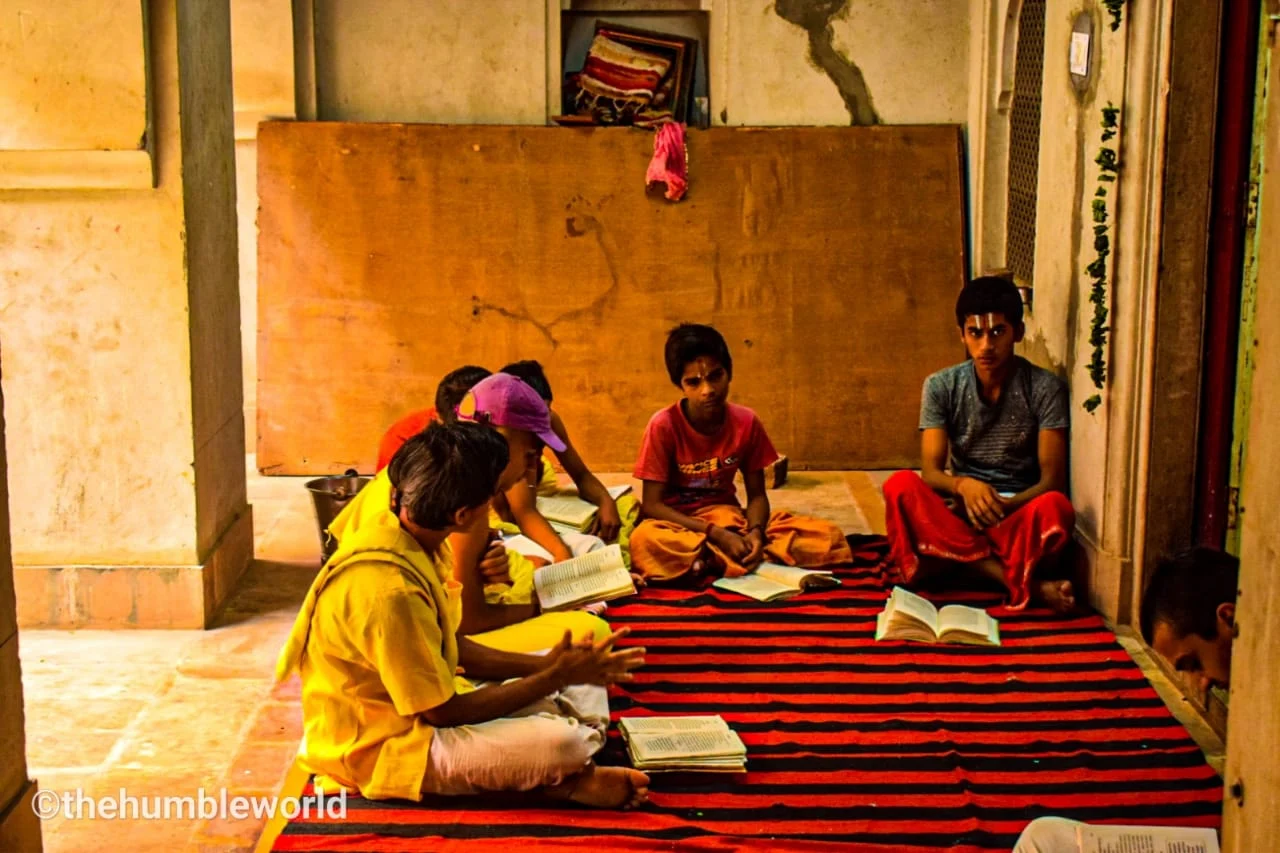 Children offering prayer and learning from Guruji inside GaltaJi Temple