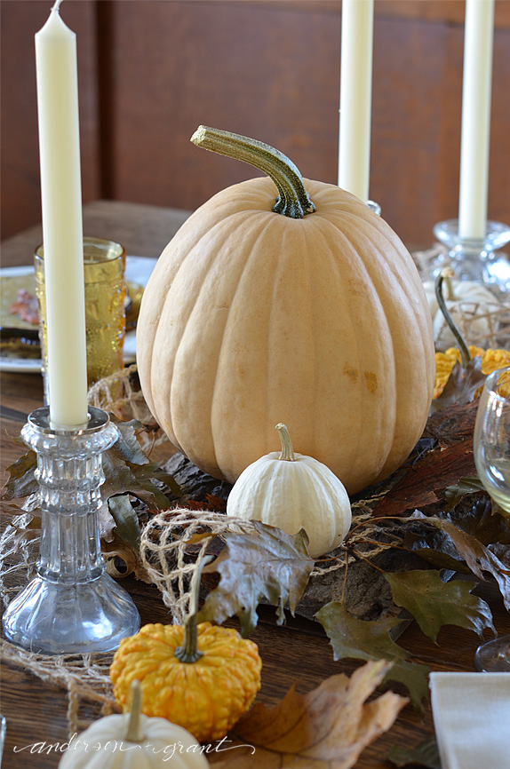 Large yellow pumpkin as centerpiece for Thanksgiving table | www.andersonandgrant.com