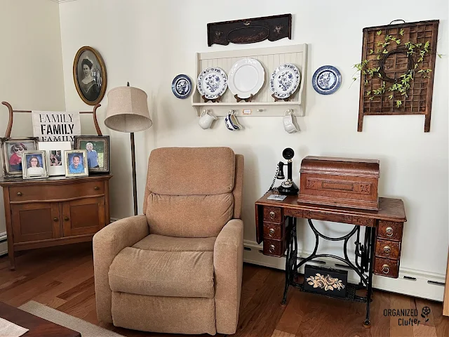 Photo of a living room decorated with family antiques and vintage collections.