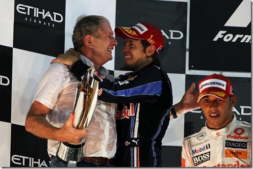 Dr Helmut Marko (AUT) Red Bull Motorsport Consultant and race winner Sebastian Vettel (GER) Red Bull Racing celebrate on the podium Abu dhabi 2010