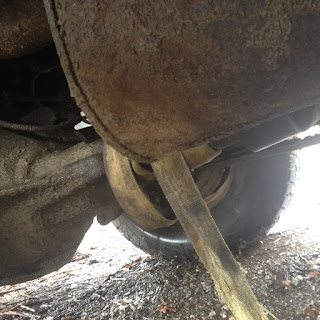 Strap wrapped up in drive shaft