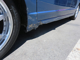 Dented fender and rocker panel before collision repairs at Almost Everything Auto Body