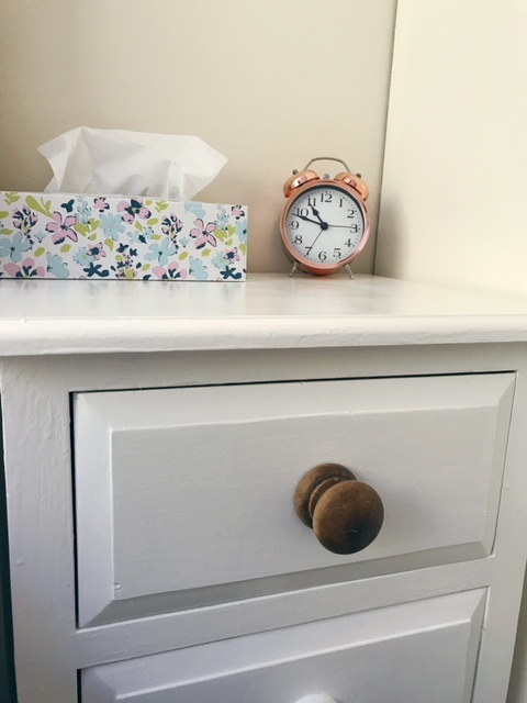 Beside drawers showing wooden handles