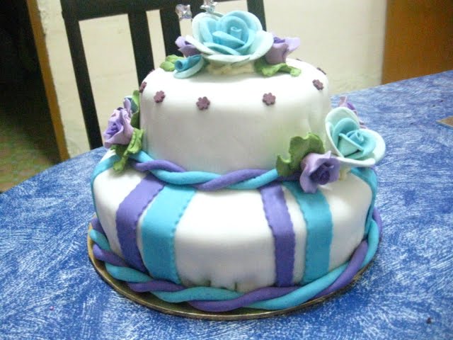 2 tier fondant cake with blue and purple theme ordered by Ms Ayna Mardiah 