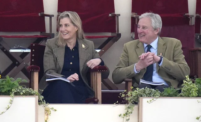 The Duchess of Edinburgh wore a navy ponte fit flare midi dress by ME+EM, and carries brown leather handbag by Isabel Marant