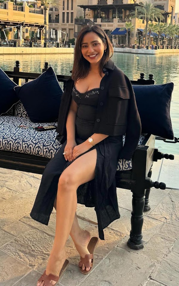 neha sharma cleavage legs thighs black outfit