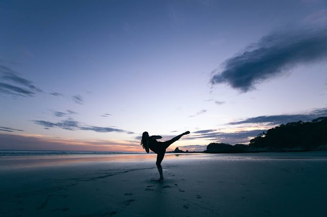 Silhouette of a Person Kicking the Air