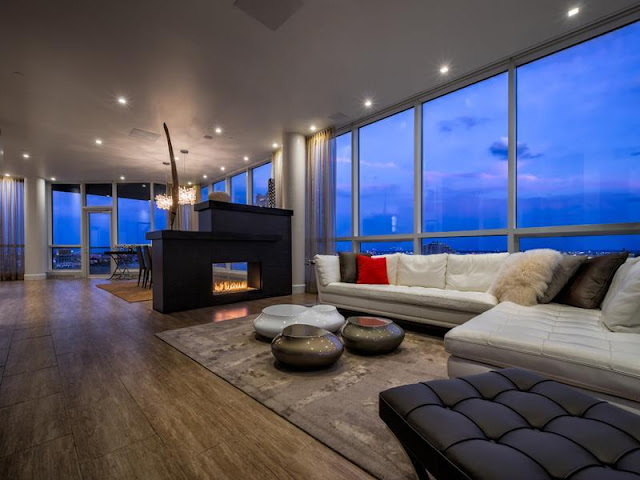 Photo of living room with modern fireplace in Philadelphia penthouse