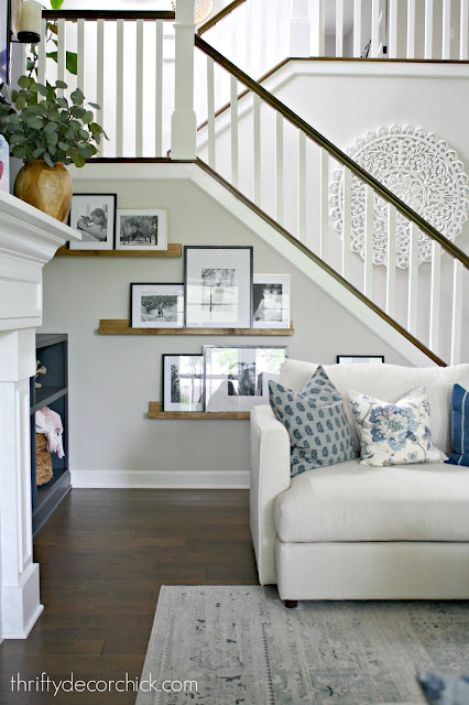 DIY picture ledges under stairs