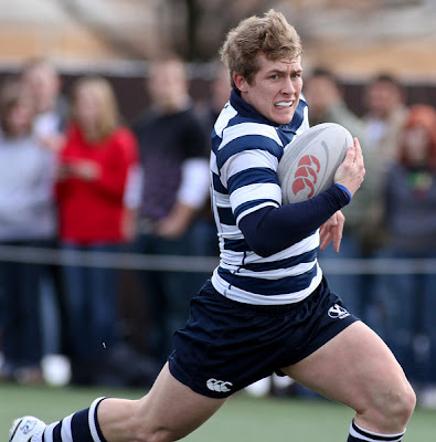 BYU Rugby Flyhalf Dylan Lubbe strains to get up to speed in eluding the last of the Utah State line