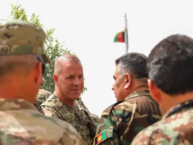 US Army Brigadier General Jeffrey Smiley (second left) was among 13 wounded when a gunman wearing an Afghan security forces uniform opened fire on a gathering that included General Scott Miller