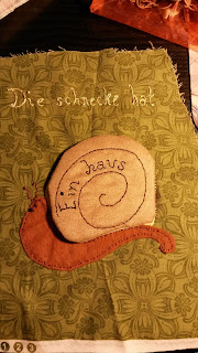 8a. The completed page with flap closed "Die schneke hat ein haus" - The snail has a shell