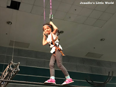 Child walking on a tight rope