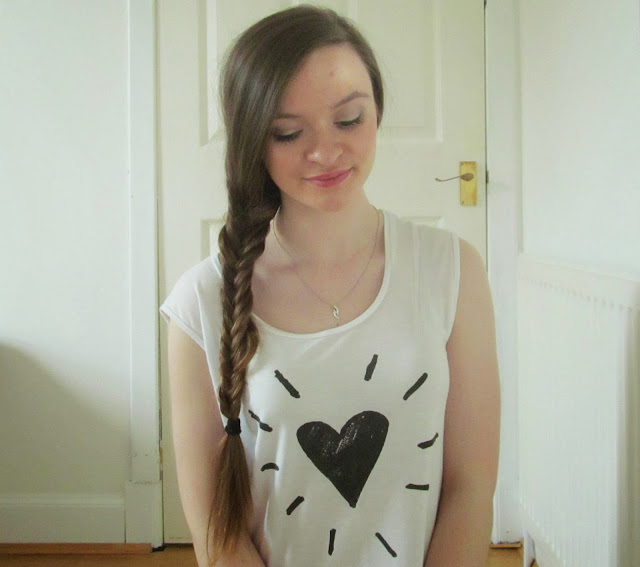 girl with long brown hair plaited on left