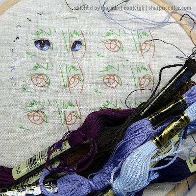 Royal School of Needlework Pet Portrait: First attempt at embroidering cat's eyes (in blue)