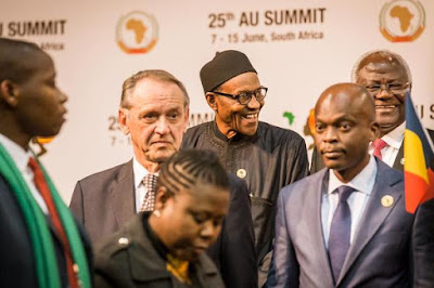 Buhari smiles at a photo session in AU Summit