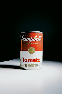 Campbell's Tomato Soup Can photo by Girl with red hat on Unsplash - https://unsplash.com/photos/C0MAGd-6aZM