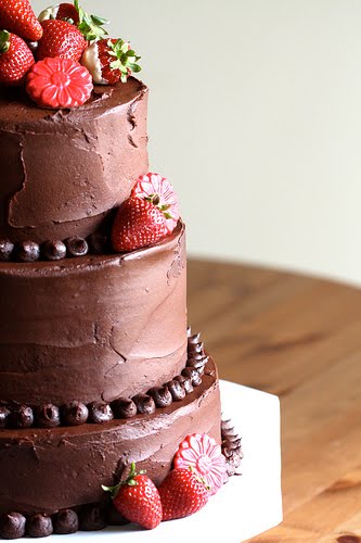 Three tier round chocolate wedding cake Four tier round chocolate covered 