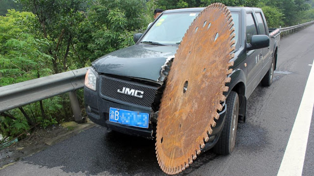 Chinese Man Escapes Unhurt After Huge Saw Blade Slices Truck
