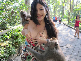 Charmian Chen, 陳維芊 (Chén wéiqiān) stripped by monkeys. The monkeys decided she was a little overdressed and pulled her dress down.