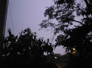 Anatomy of a lightning strike frame 2: The sky starts to turn purple as a pre-flash builds