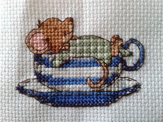 Cross stitch mouse in a tea cup