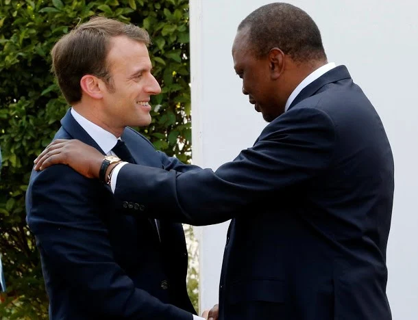 French President Emanuel Macron is welcomed by President Uhuru Kenyatta at State House on March 13, 2019.