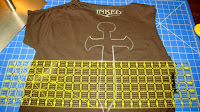 Cut a design on a t-shirt using a chalk outline as a guide.