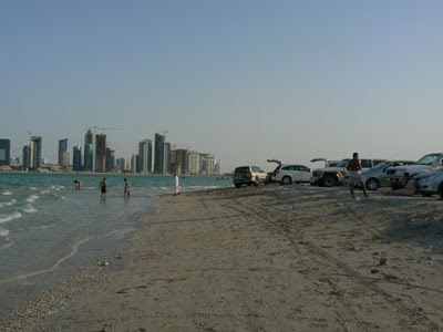 Land cruisers drawn up on a Doha beach