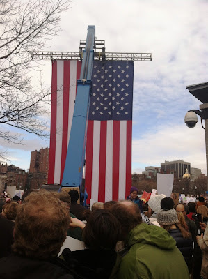 200,000 plus Protesters Exercise Their First Amendment Rights  Under a Large American Flag at the Boston Women's March