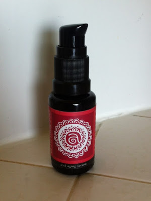 This is a picture of Annmarie Anti-Aging Serum in a dark pump-style bottle.