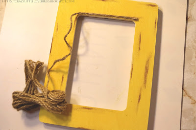 Twine being applied to yellow frame