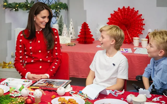 The Princess of Wales wore a cotton trimmed cashmere jacquard cardigan in red by Miu Miu. Red trousers