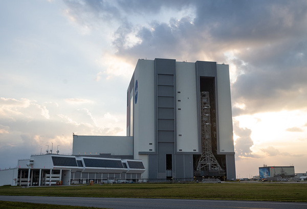 The giant doors to the Vehicle Assembly Building's High Bay 3 are open as the mobile launcher carrying NASA's Space Launch System rocket prepares to roll to Kennedy Space Center's Pad 39B for final flight preps...on August 16, 2022.