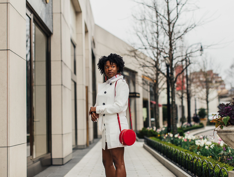 Blogger wearing white jacket and skirt