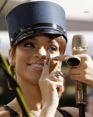 rihanna tattoos gun. Rihanna gets gun tattoos and