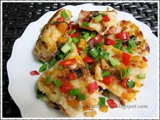 An unlinked picture of a plate of Pan-fried savoury steamed pumpkin cake