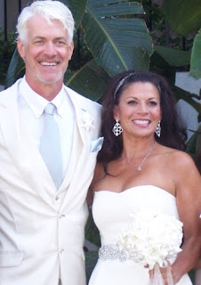 Dina Eastwood with her husband Scott Fisher in their wedding dress