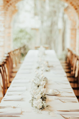 simple white reception centerpiece and tables