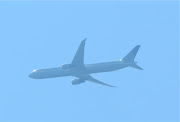 An airplane flying overhead. (img )