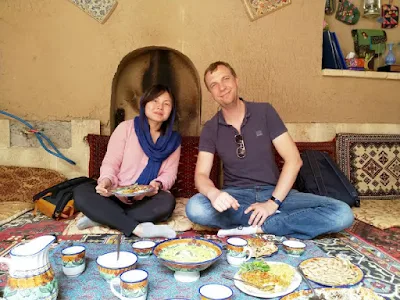 In Iran, all family members gather around traditional table cloth, also known as sofreh, which is spread on the floor during meals. As you see in this photo, this very simple ancient practice of sitting on the floor while eating is done with our European guests in a traditional guesthouse in ancient Yazd. 