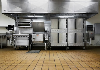 Restaurant kitchen equipment for sale in a food service warehouse
