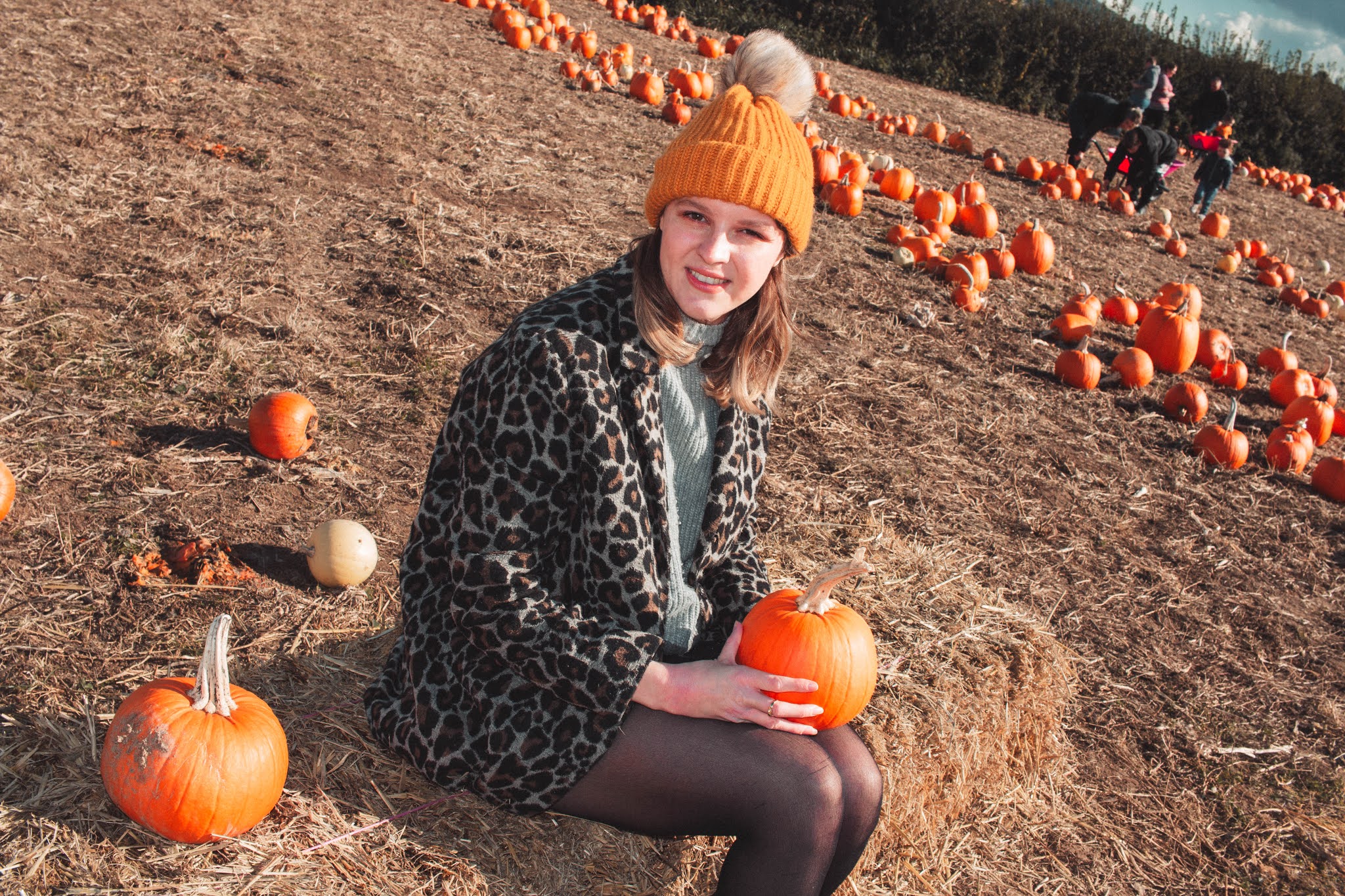 Girl with Autumn Pumpkins at Pumpkin Patch from Fall Pumpkin Picking Autumn Activities Blog Post