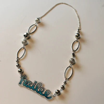http://www.doodlecraftblog.com/2014/04/shrink-plastic-name-necklace.html