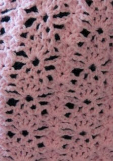 http://donnascrochetdesigns.com/morefree/strawberry%20lace%20box%20poncho.pdf